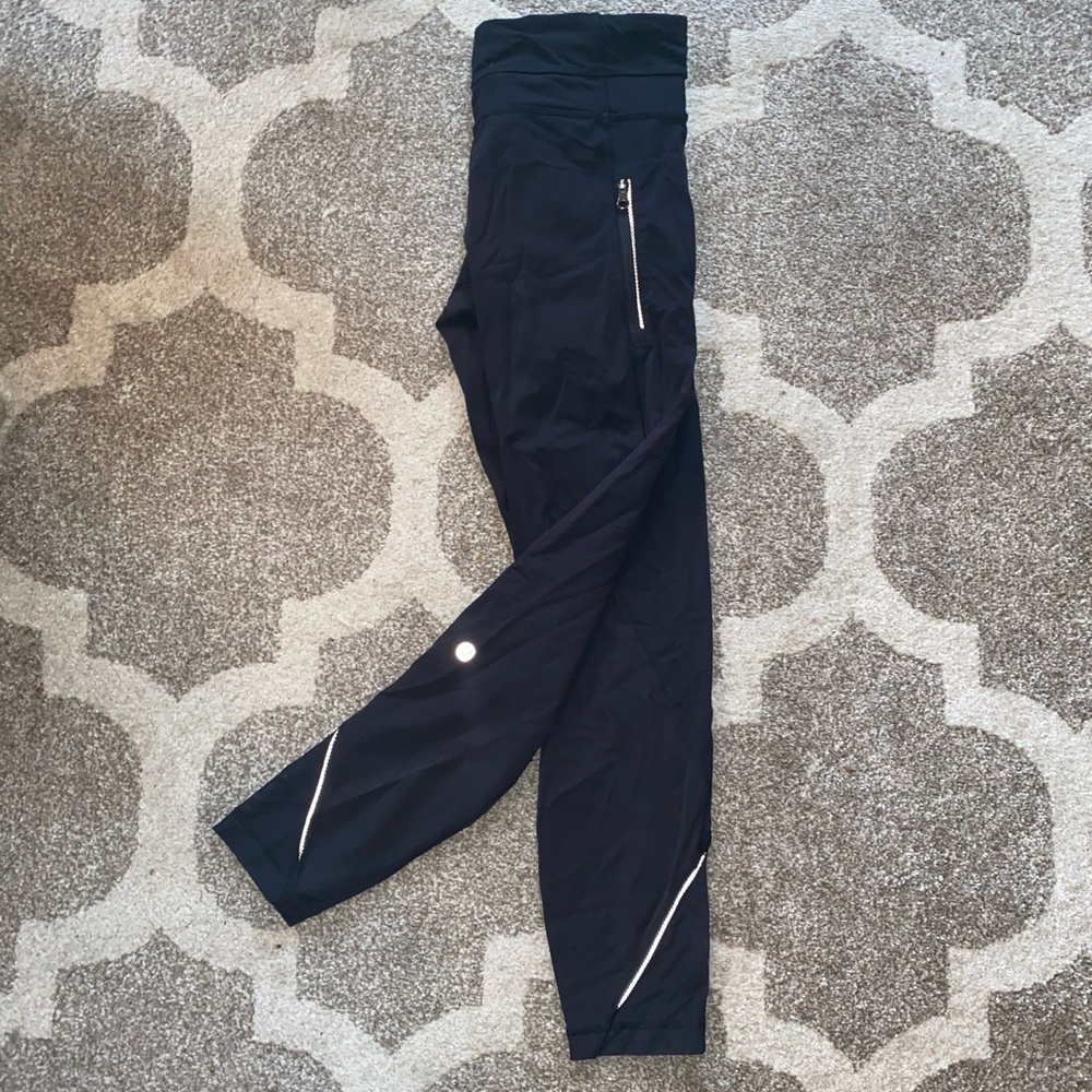 Lululemon size 6 leggings ! Reflective detail and logo at the back of the leg.